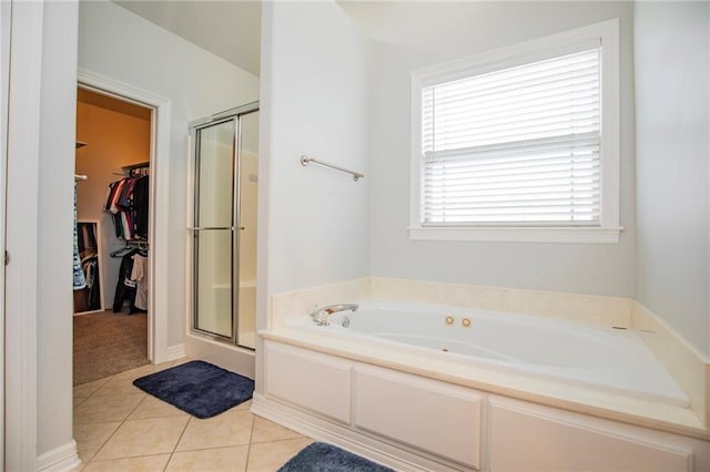 bathroom with tile patterned floors and plus walk in shower