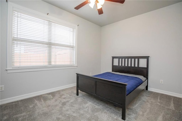 bedroom featuring light carpet and ceiling fan