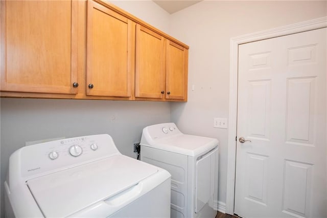 laundry area with cabinets and independent washer and dryer