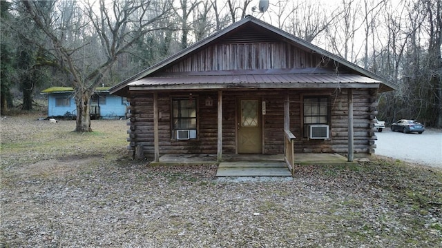 log-style house with cooling unit