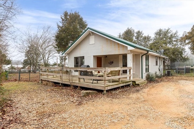 back of property featuring a wooden deck and central air condition unit