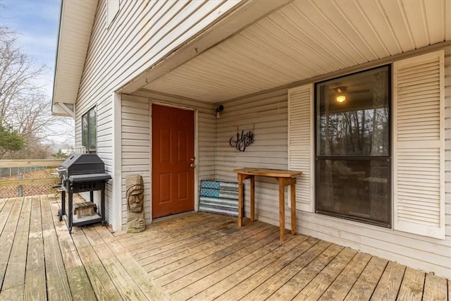 wooden terrace with area for grilling