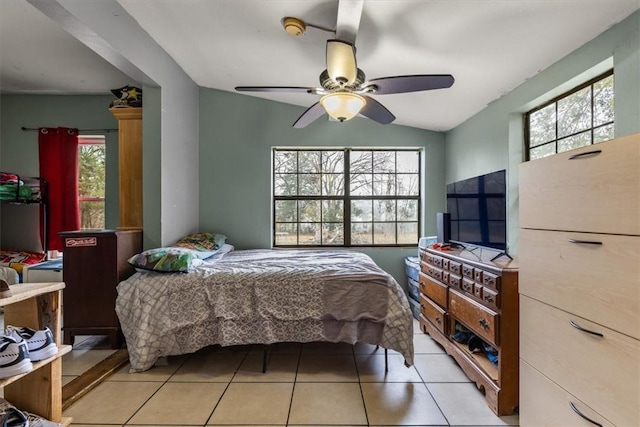 tiled bedroom with vaulted ceiling and ceiling fan