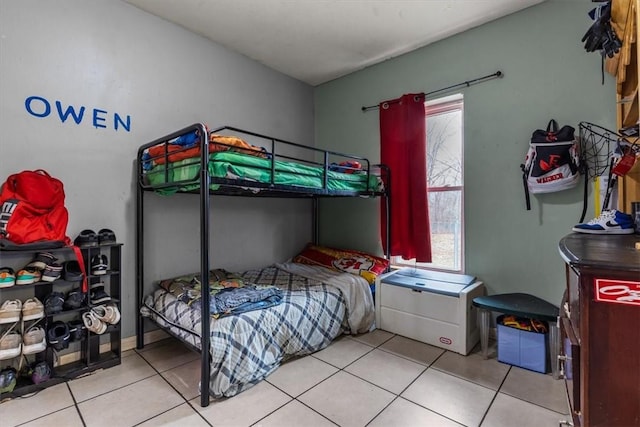 bedroom featuring light tile patterned floors