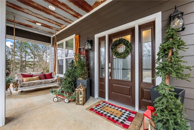 entrance to property featuring a porch