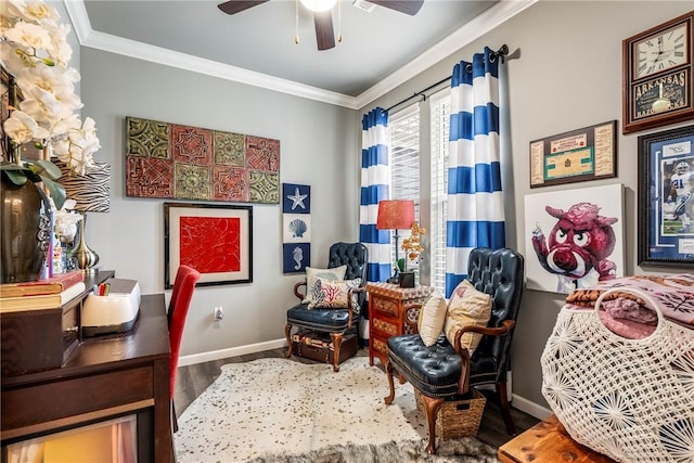 sitting room featuring hardwood / wood-style flooring, ornamental molding, and ceiling fan