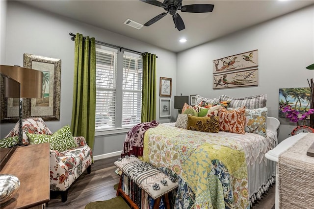 bedroom featuring dark hardwood / wood-style flooring and ceiling fan