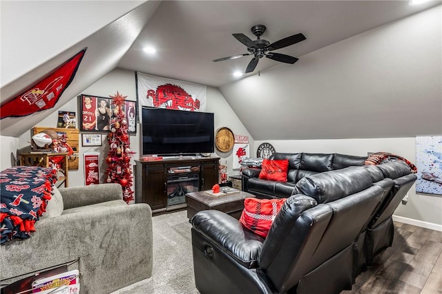 living room with hardwood / wood-style flooring, ceiling fan, and lofted ceiling