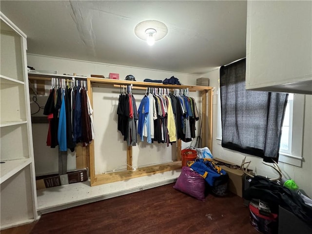 walk in closet with hardwood / wood-style floors