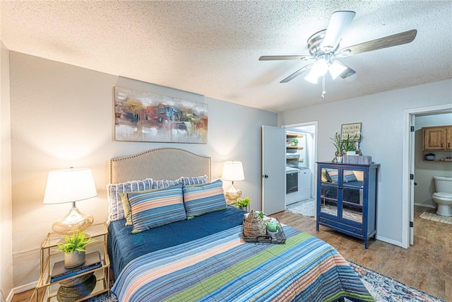 bedroom featuring ceiling fan, hardwood / wood-style floors, a textured ceiling, and ensuite bath