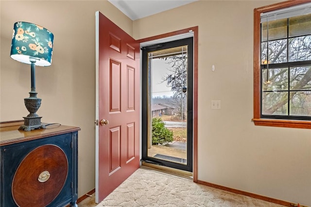 view of carpeted entrance foyer