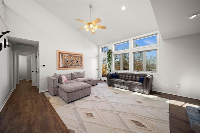 living room featuring ceiling fan, high vaulted ceiling, and light hardwood / wood-style flooring