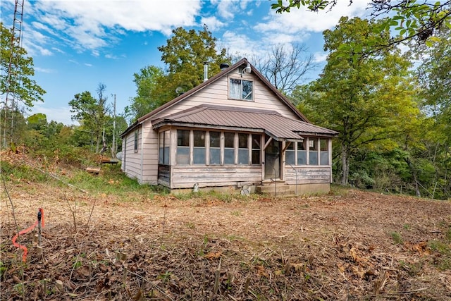 view of front facade with a sunroom