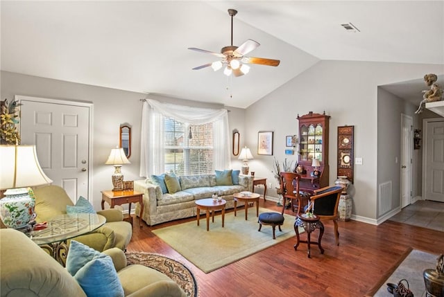 living room featuring lofted ceiling, hardwood / wood-style floors, and ceiling fan