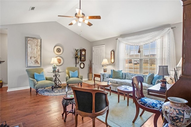 living room featuring vaulted ceiling, hardwood / wood-style floors, and ceiling fan