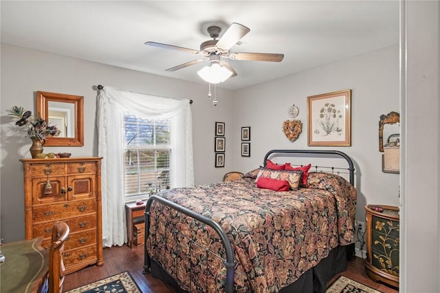 bedroom featuring dark hardwood / wood-style floors and ceiling fan