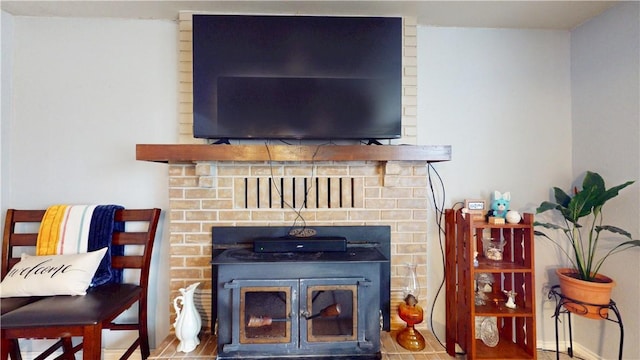 interior details featuring a brick fireplace