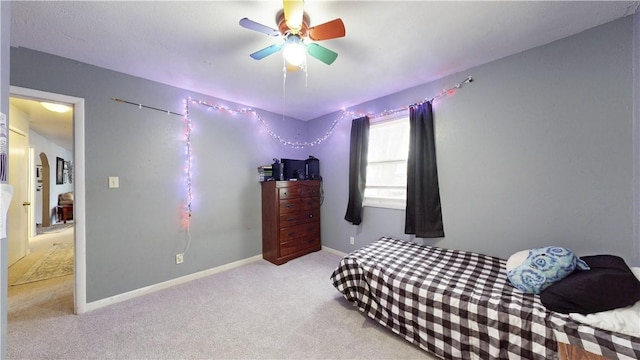 bedroom with light colored carpet and ceiling fan