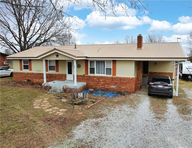 ranch-style home featuring a carport