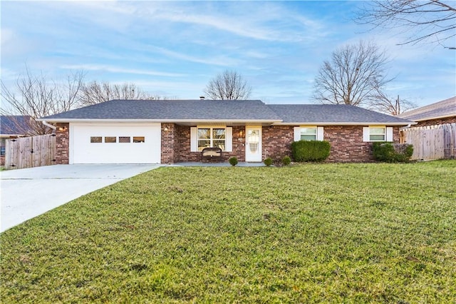 ranch-style home featuring a front yard, an attached garage, driveway, and fence