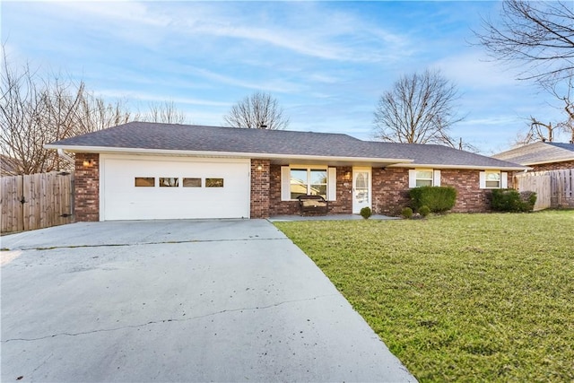 ranch-style home featuring driveway, a front lawn, fence, a garage, and brick siding