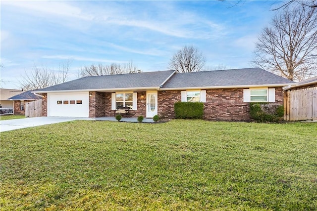 single story home featuring brick siding, a front lawn, fence, concrete driveway, and a garage