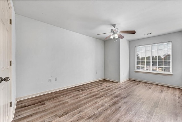 unfurnished room featuring ceiling fan and light hardwood / wood-style floors