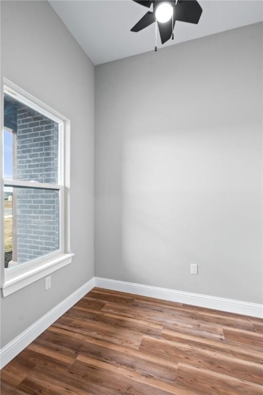 empty room with hardwood / wood-style flooring and ceiling fan