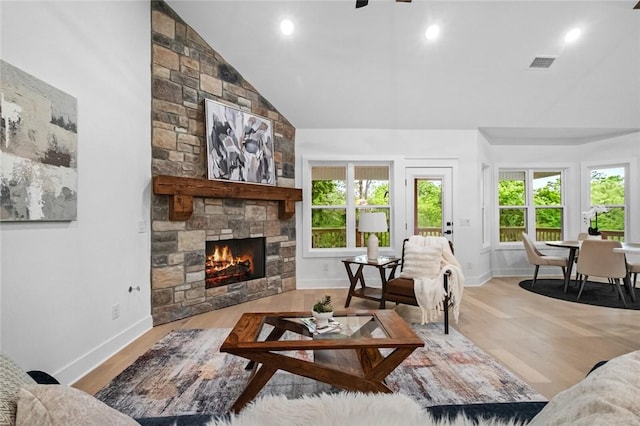 738 Cardin Spur, Pea Ridge, AR 72751 - living area with a fireplace, wood finished floors, baseboards, recessed lighting, and high vaulted ceiling