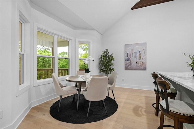 738 Cardin Spur, Pea Ridge, AR 72751 - dining room featuring lofted ceiling, light wood-type flooring, and baseboards