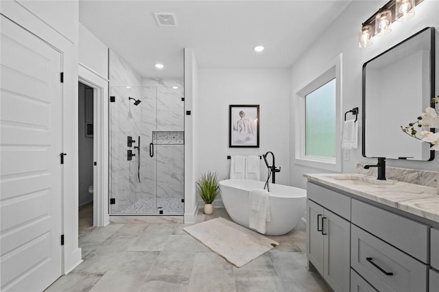 738 Cardin Spur, Pea Ridge, AR 72751 - bathroom with a soaking tub, a marble finish shower, double vanity, recessed lighting, and marble look tiles