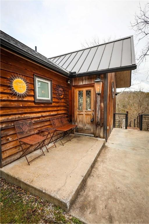 entrance to property featuring a patio area