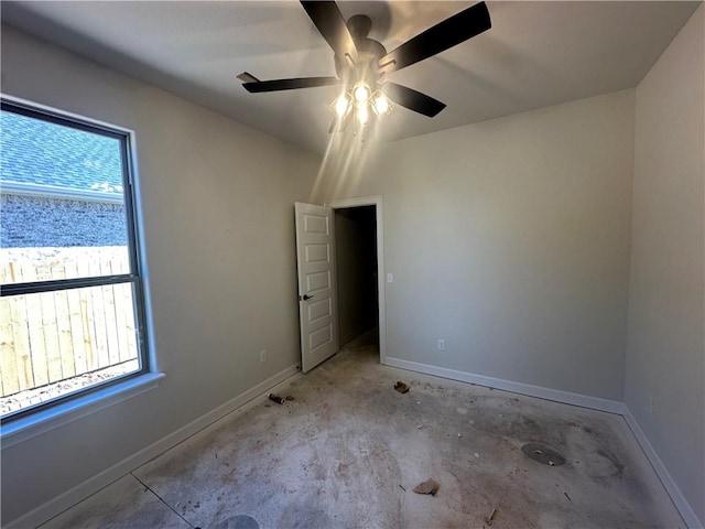 unfurnished bedroom with baseboards and ceiling fan