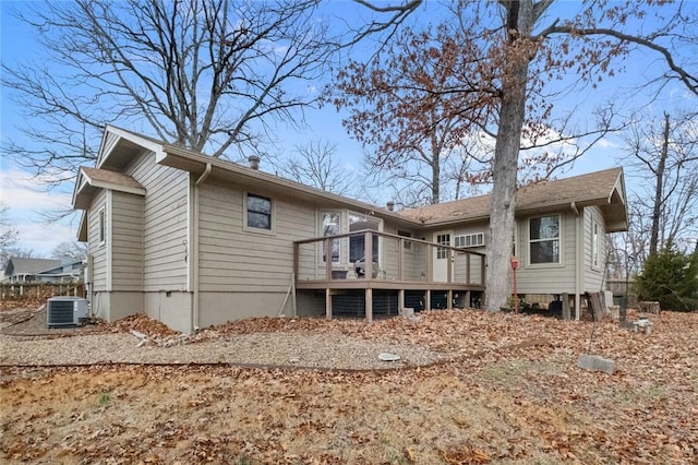 back of property featuring cooling unit and a wooden deck