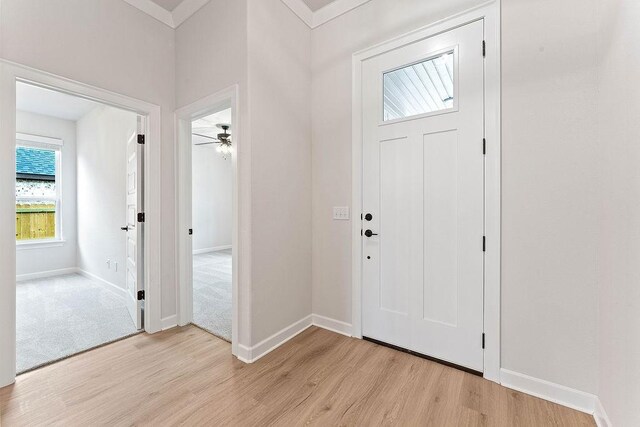 1815 Bugg St, Pea Ridge, AR 72751 - entrance foyer featuring light wood-type flooring, a ceiling fan, and baseboards