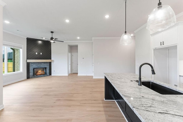 1815 Bugg St, Pea Ridge, AR 72751 - kitchen featuring a sink, ceiling fan, ornamental molding, recessed lighting, and white cabinetry