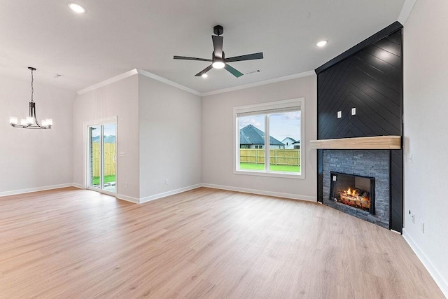 1815 Bugg St, Pea Ridge, AR 72751 - unfurnished living room with plenty of natural light, light wood finished floors, a chandelier, crown molding, and recessed lighting