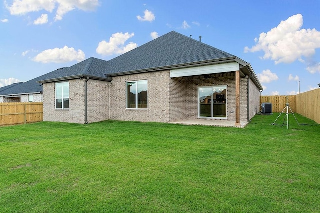 1815 Bugg St, Pea Ridge, AR 72751 - rear view of property with central air condition unit, brick siding, roof with shingles, and a patio