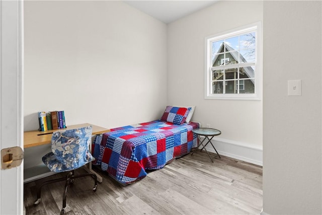 bedroom featuring wood-type flooring