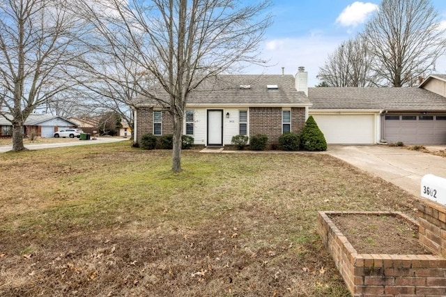 ranch-style house featuring a garage and a front yard