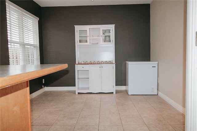 interior space with light tile patterned floors