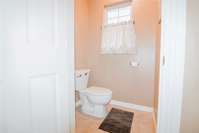 bathroom featuring tile patterned flooring and toilet