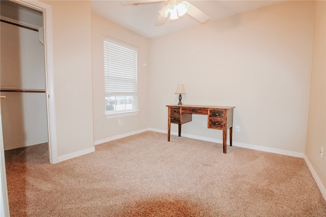 carpeted bedroom featuring a closet and ceiling fan