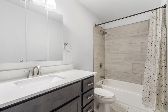 full bathroom with shower / tub combo with curtain, vanity, and toilet