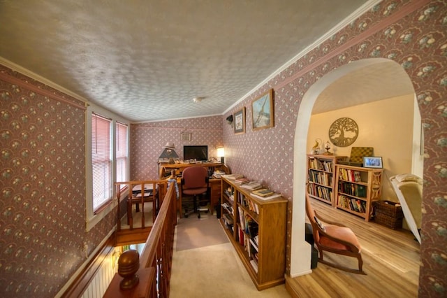 interior space with wood-type flooring and ornamental molding