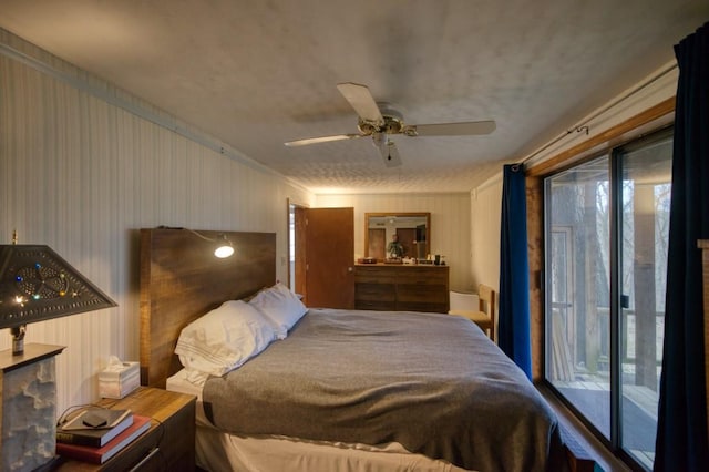 bedroom featuring ceiling fan and access to outside