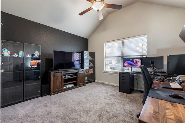 office space with vaulted ceiling, carpet flooring, and ceiling fan