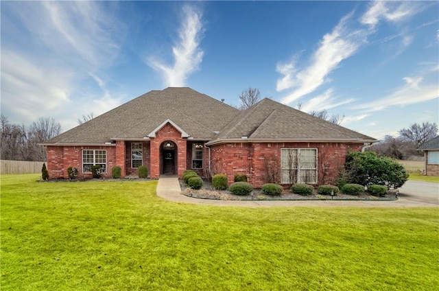 ranch-style house with a front lawn