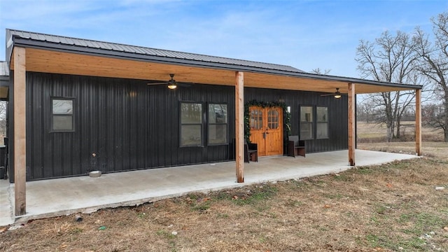 rear view of house with a patio area and ceiling fan