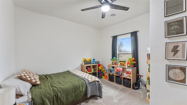 bedroom with ceiling fan and carpet